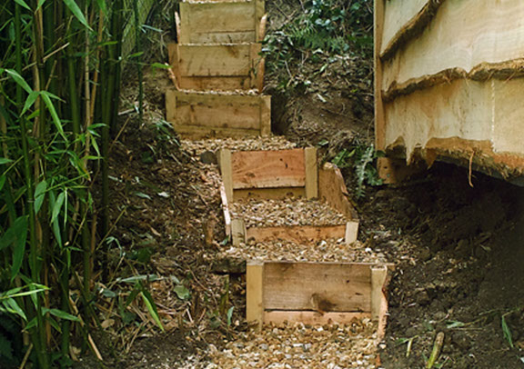 wooden steps leading to timber playhouse dorset