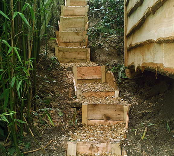 wooden steps leading to timber playhouse dorset